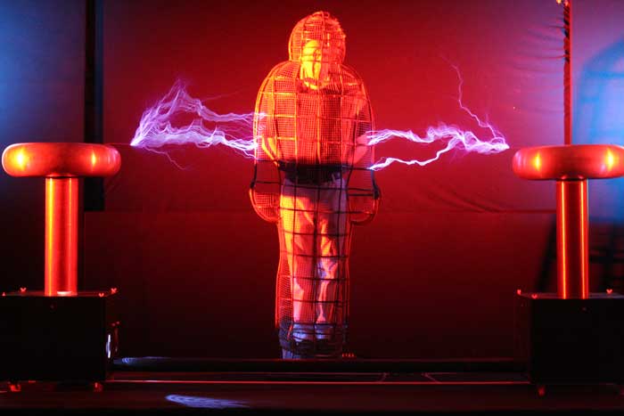 An SG30 Twin Tesla coil with a sarcophagus Faraday Cage high voltage special effect
